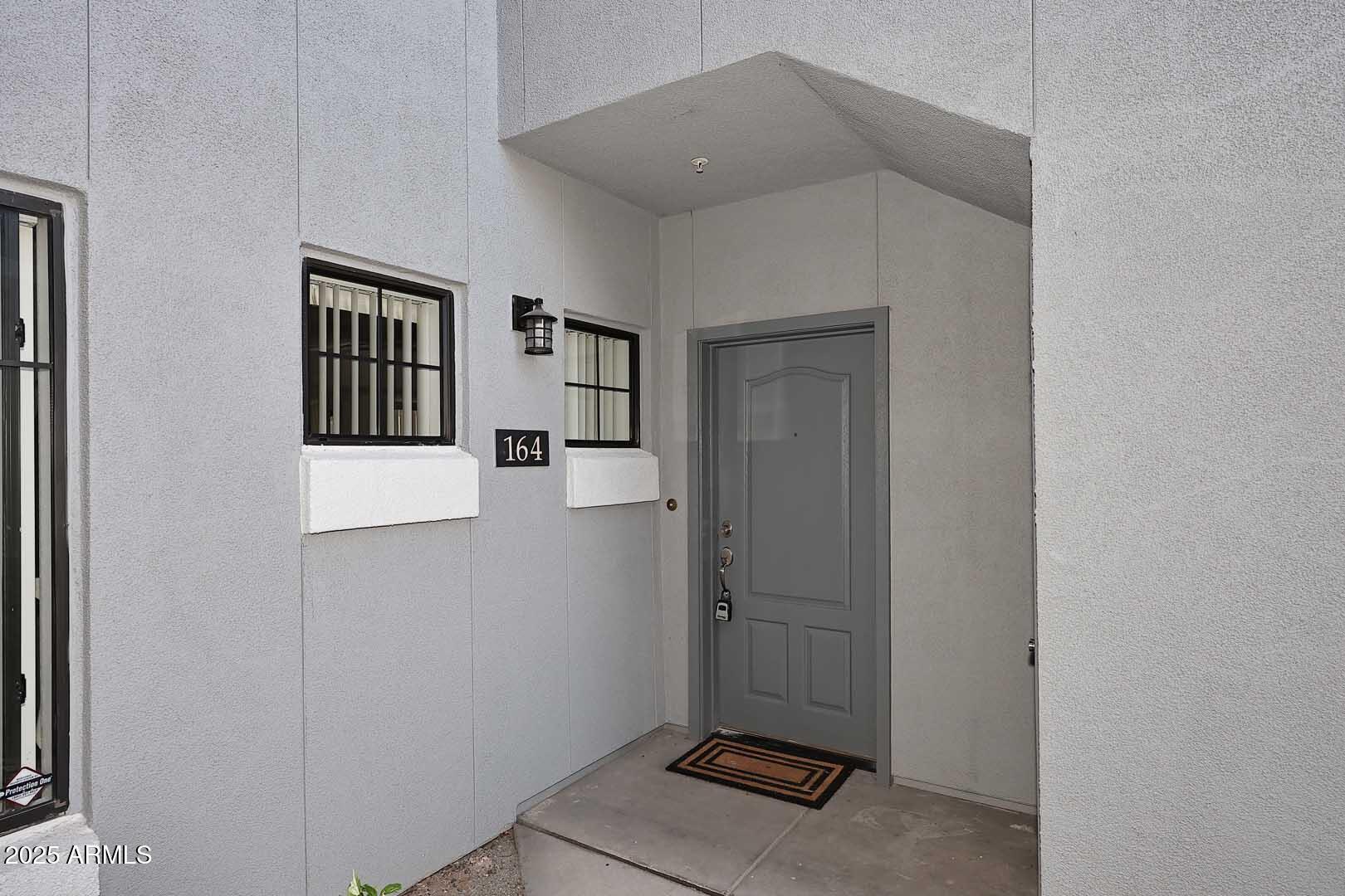 295 North Rural Road, Unit 164 Chandler, AZ 85226 - Photo 2 of 24 a view of a hallway with closet