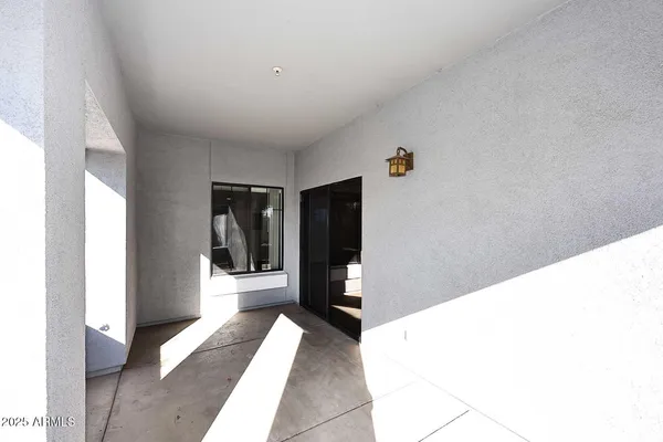 a hallway with a furniture and storage
