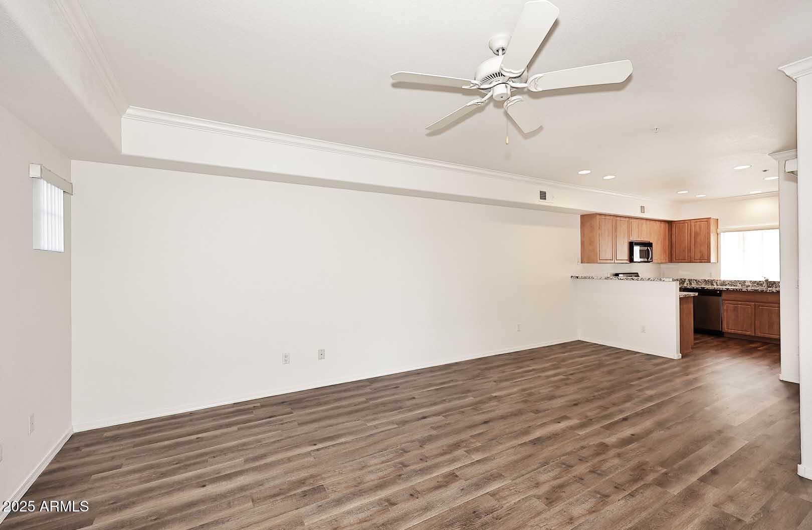 295 North Rural Road, Unit 164 Chandler, AZ 85226 - Photo 5 of 24 a view of a kitchen with a sink dishwasher a refrigerator with wooden floor