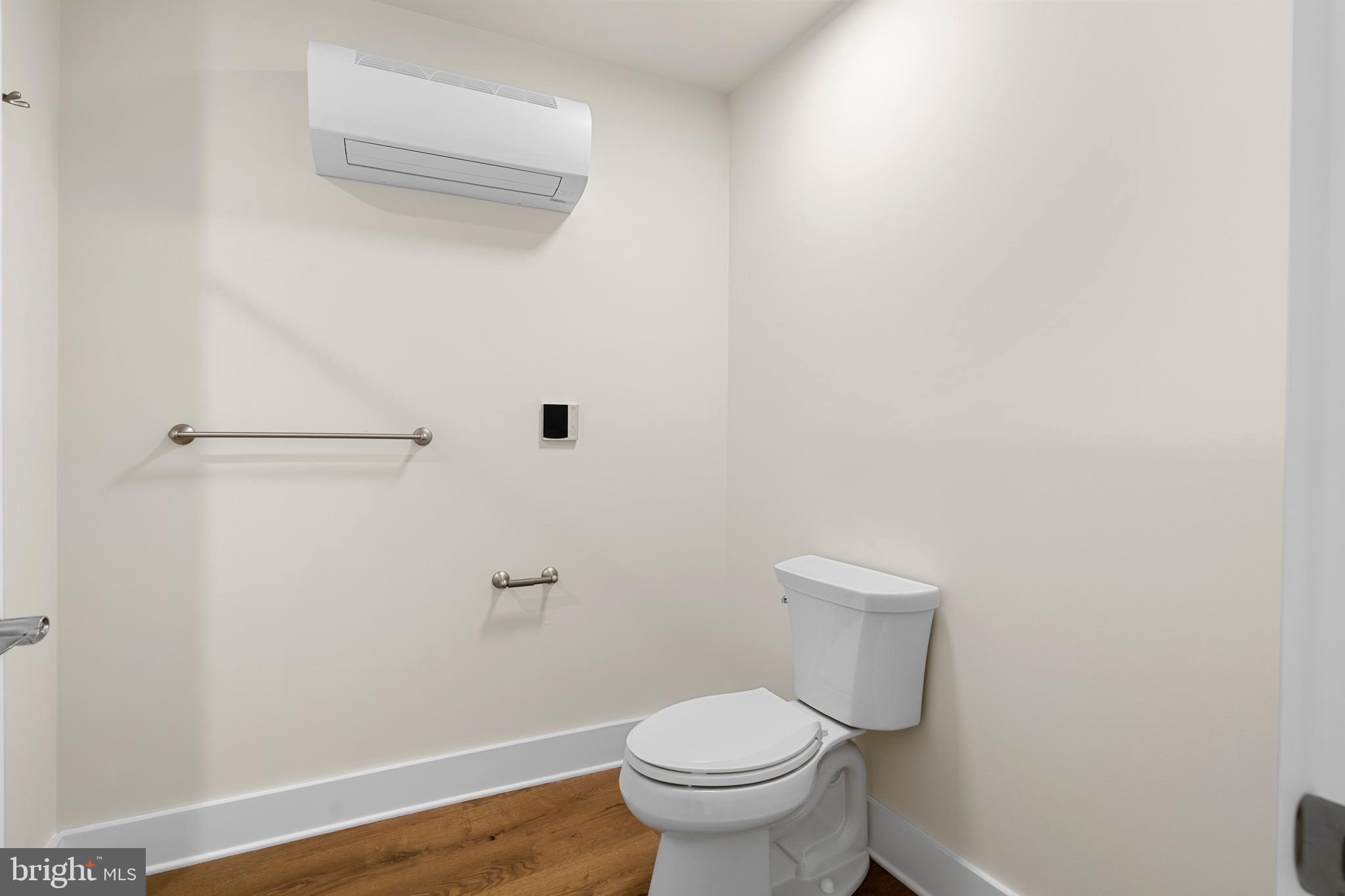 30 West Broad Street Souderton, PA 18964 - Photo 17 of 41 a white toilet sitting next to a shower