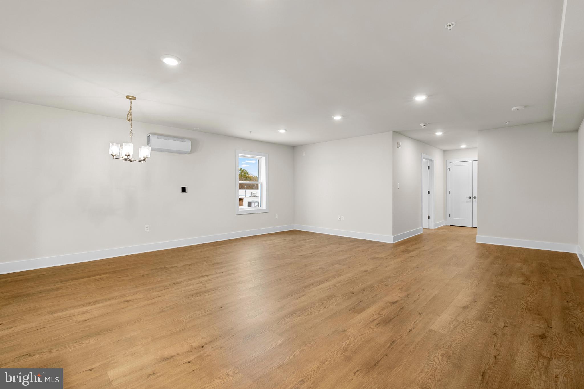 30 West Broad Street Souderton, PA 18964 - Photo 28 of 41 an empty room with wooden floor cabinet and windows