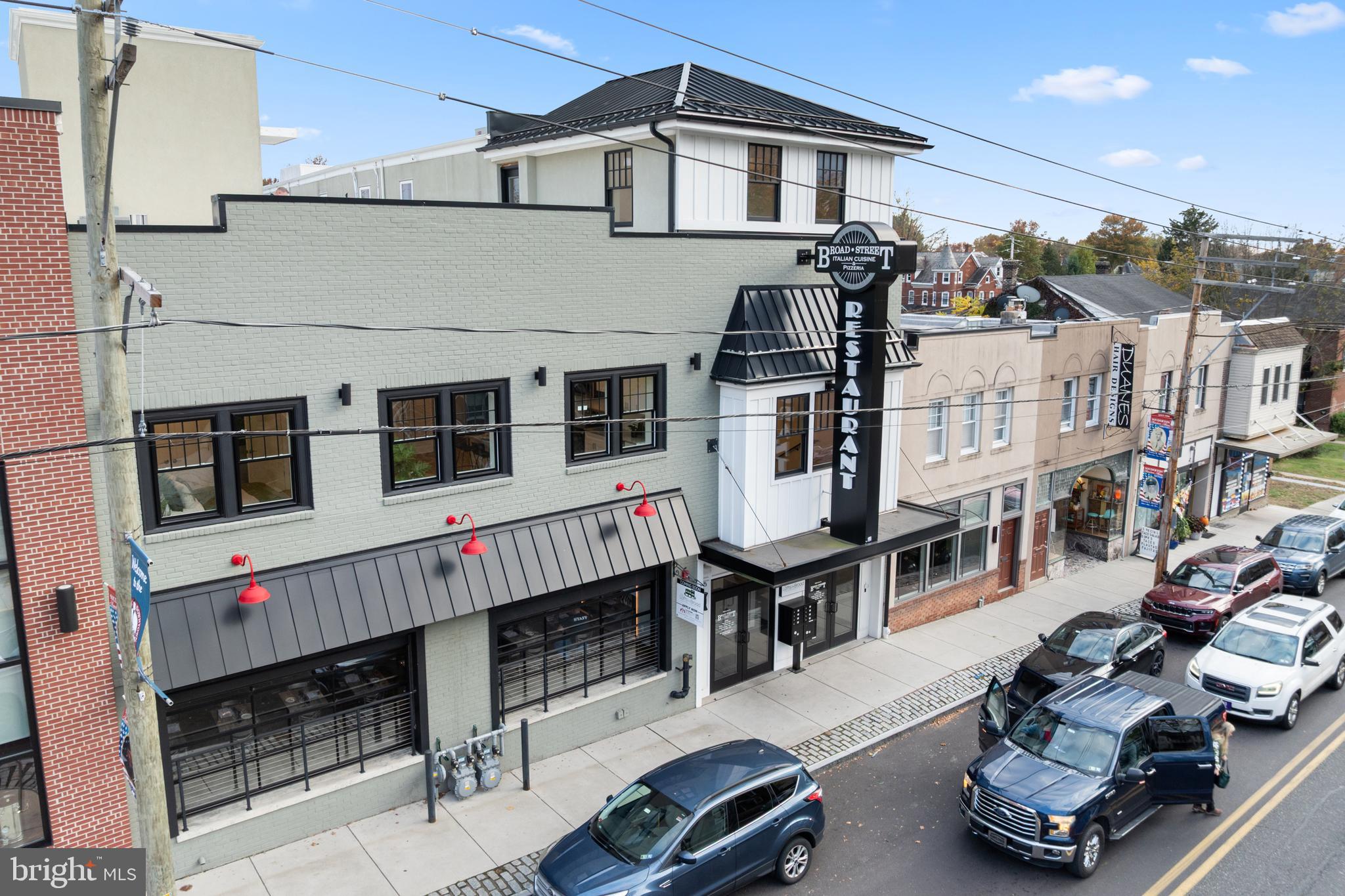 30 West Broad Street Souderton, PA 18964 - Photo 38 of 41 a building with glass top table and chairs