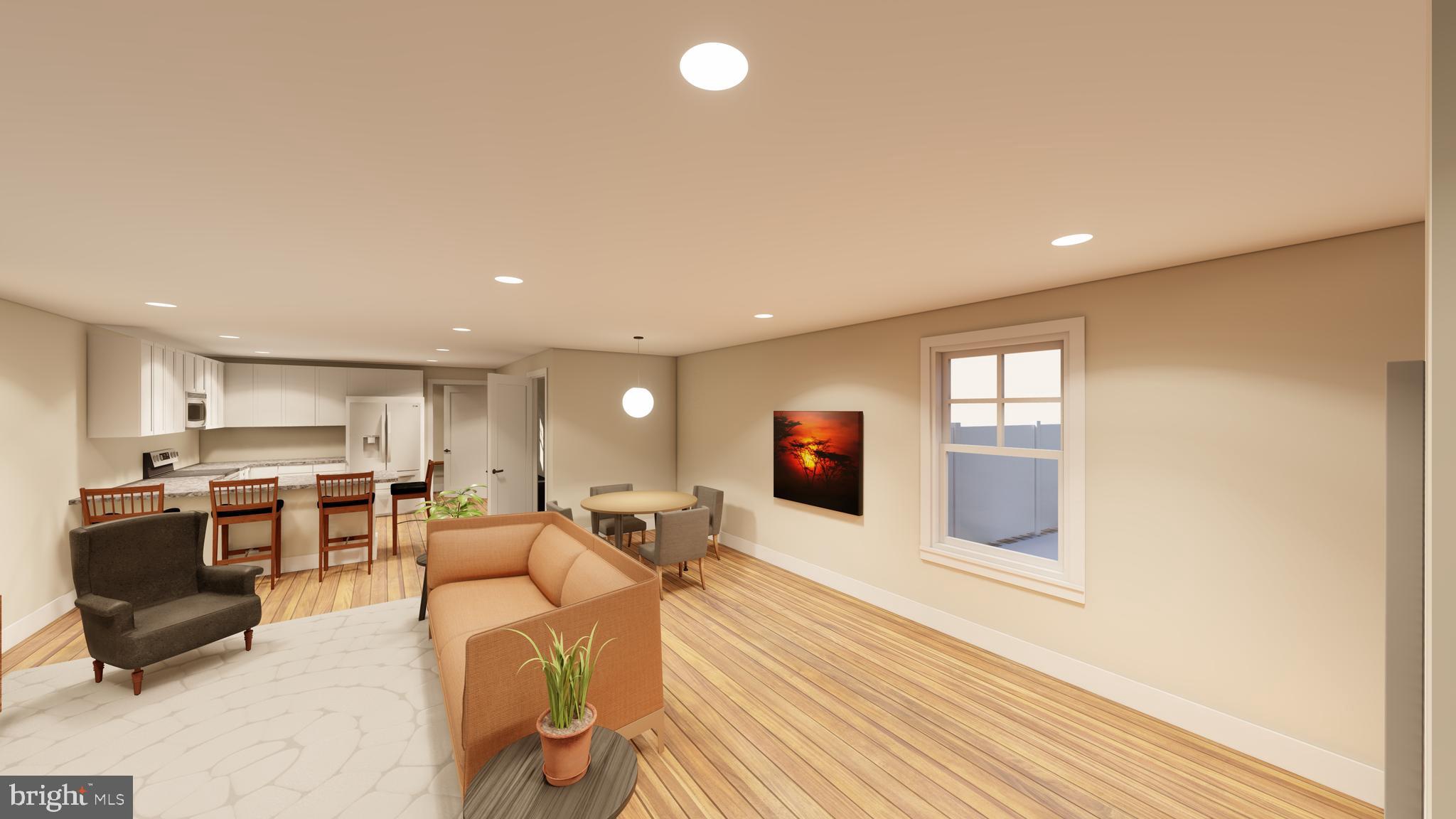 30 West Broad Street Souderton, PA 18964 - Photo 4 of 41 a living room with stainless steel appliances furniture a flat screen tv and kitchen view