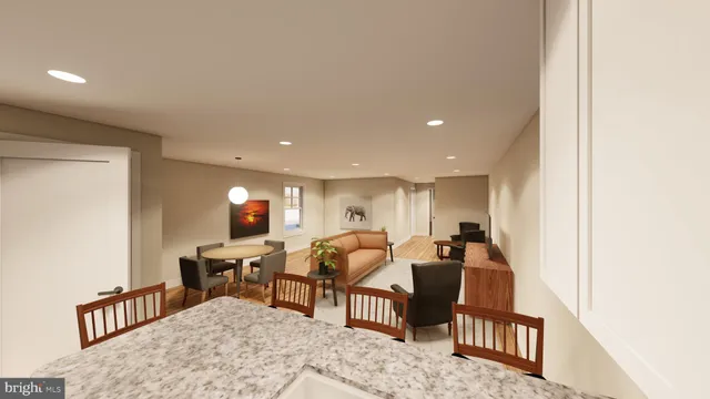 a view of a livingroom with furniture and workspace