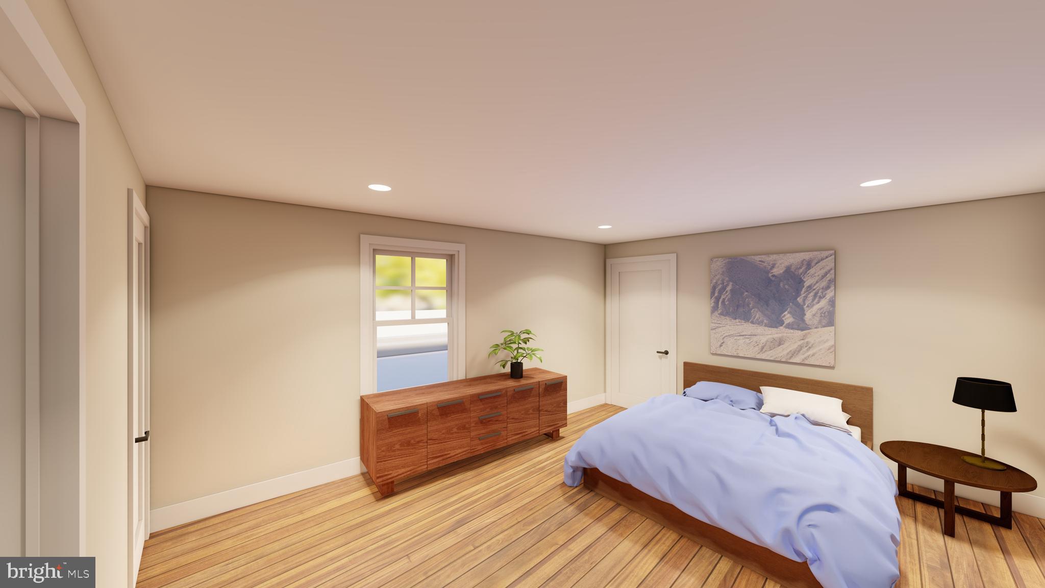 30 West Broad Street Souderton, PA 18964 - Photo 7 of 41 a spacious bedroom with a bed and wooden floor