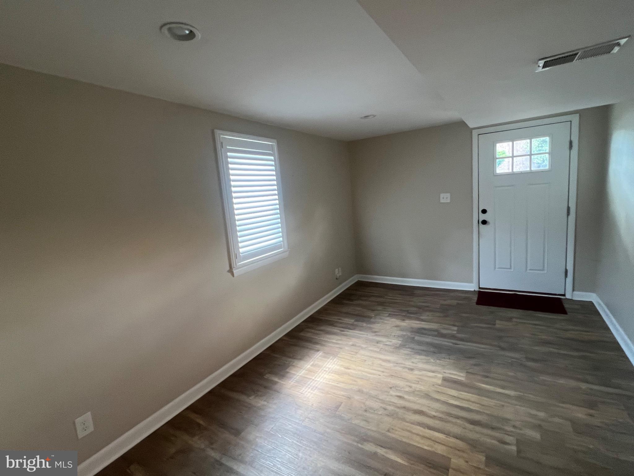20 Fairview Road Swarthmore, PA 19081 - Photo 7 of 24 an empty room with wooden floor and windows