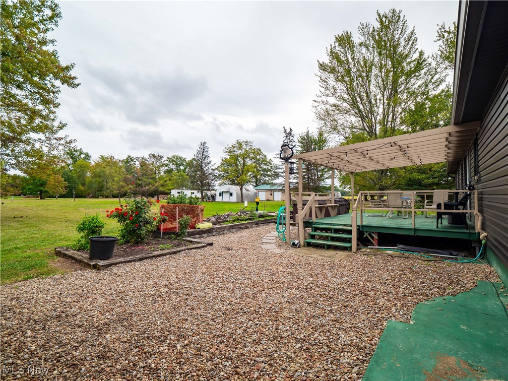 9049 Oberlin Road Elyria, OH 44035 - Photo 29 of 42 View of play area featuring a deck and a yard
