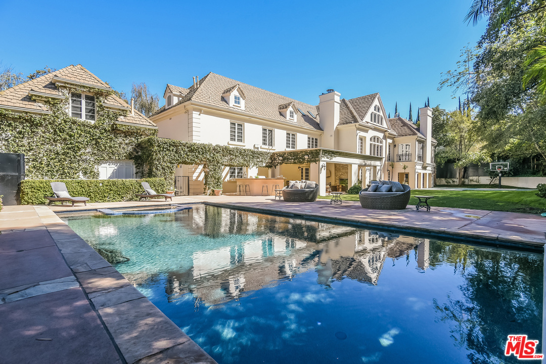 3901 Longridge Avenue Sherman Oaks, CA 91423 - Photo 2 of 51 a view of a large building with a lake view