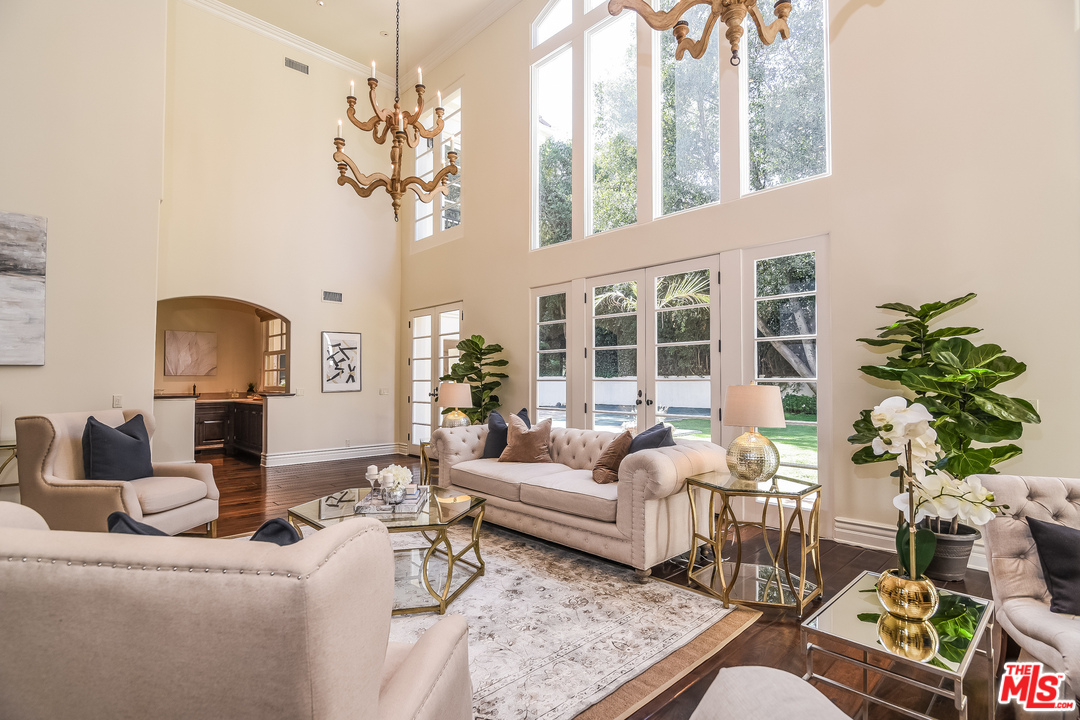 3901 Longridge Avenue Sherman Oaks, CA 91423 - Photo 13 of 51 a living room with furniture and a chandelier