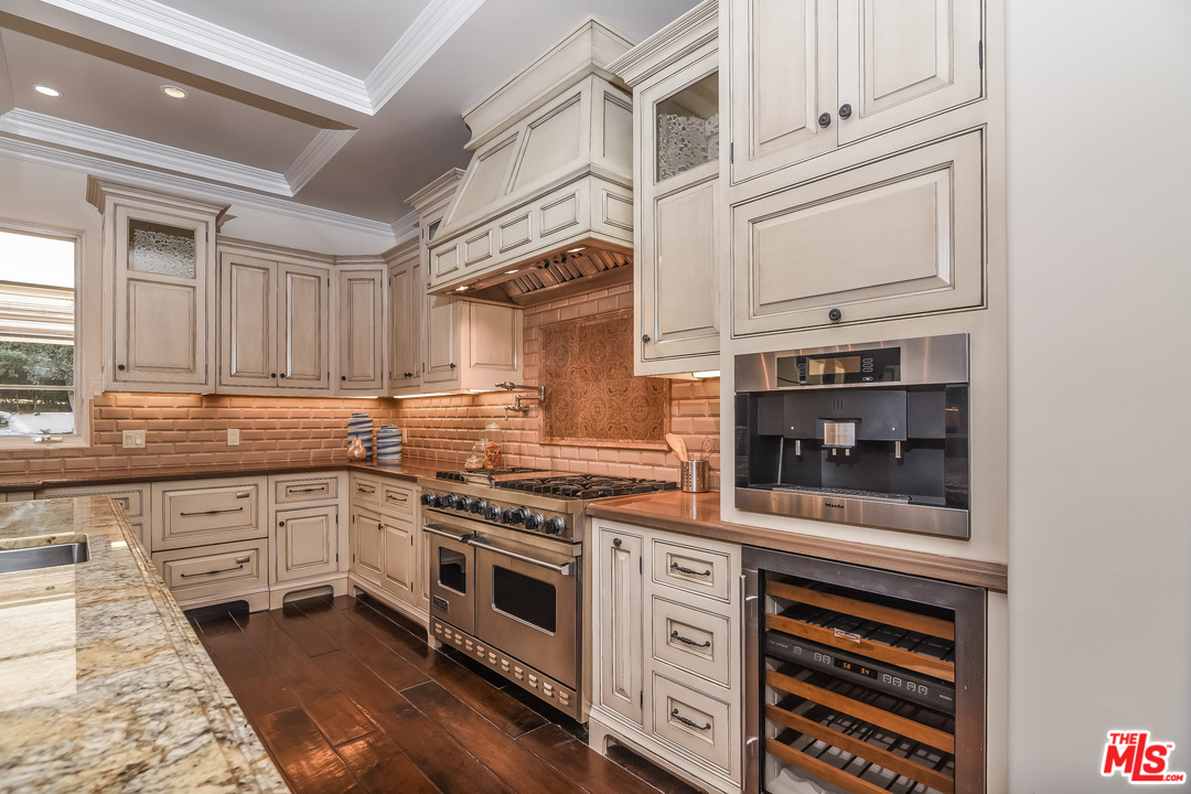 3901 Longridge Avenue Sherman Oaks, CA 91423 - Photo 14 of 51 a kitchen with stainless steel appliances granite countertop a stove and cabinets
