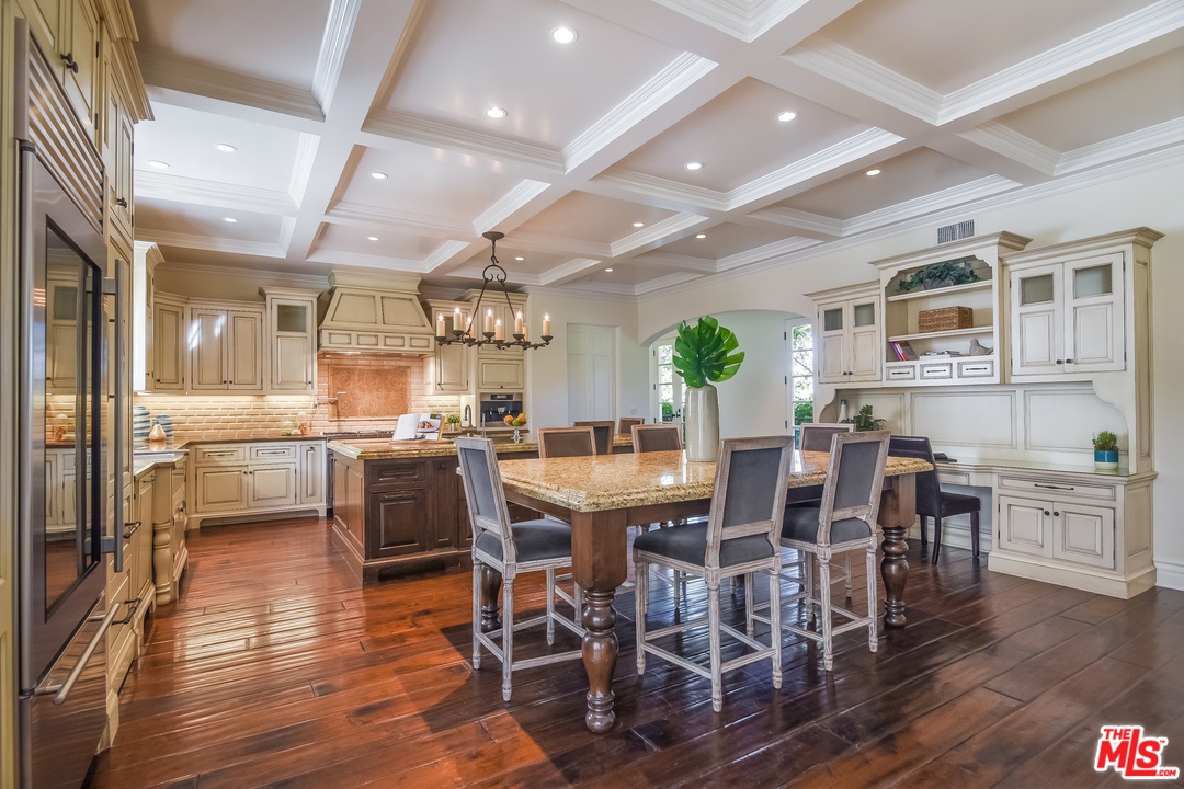3901 Longridge Avenue Sherman Oaks, CA 91423 - Photo 15 of 51 a view of a dining room with furniture window and wooden floor