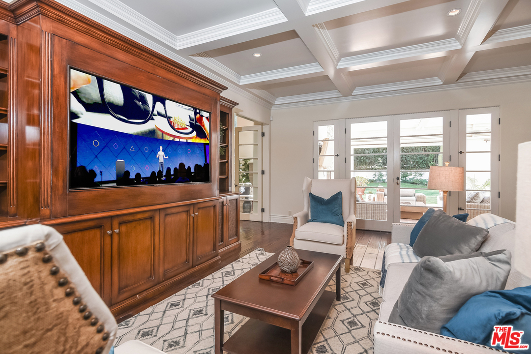 3901 Longridge Avenue Sherman Oaks, CA 91423 - Photo 16 of 51 a living room with furniture a rug and a window