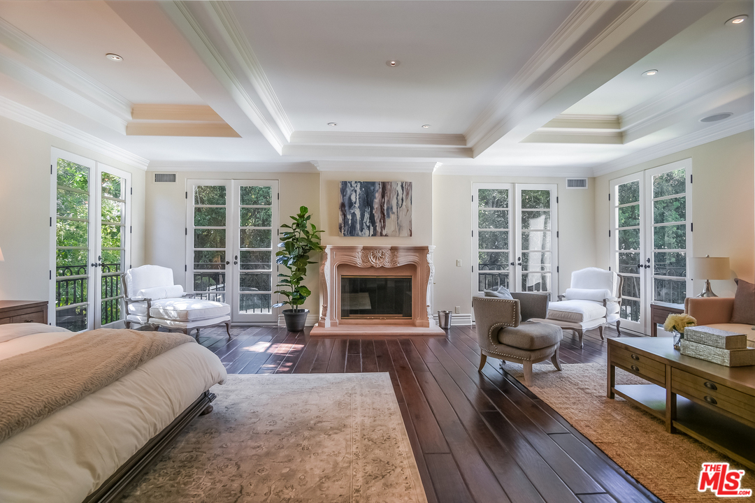 3901 Longridge Avenue Sherman Oaks, CA 91423 - Photo 23 of 51 a living room with furniture and a fireplace