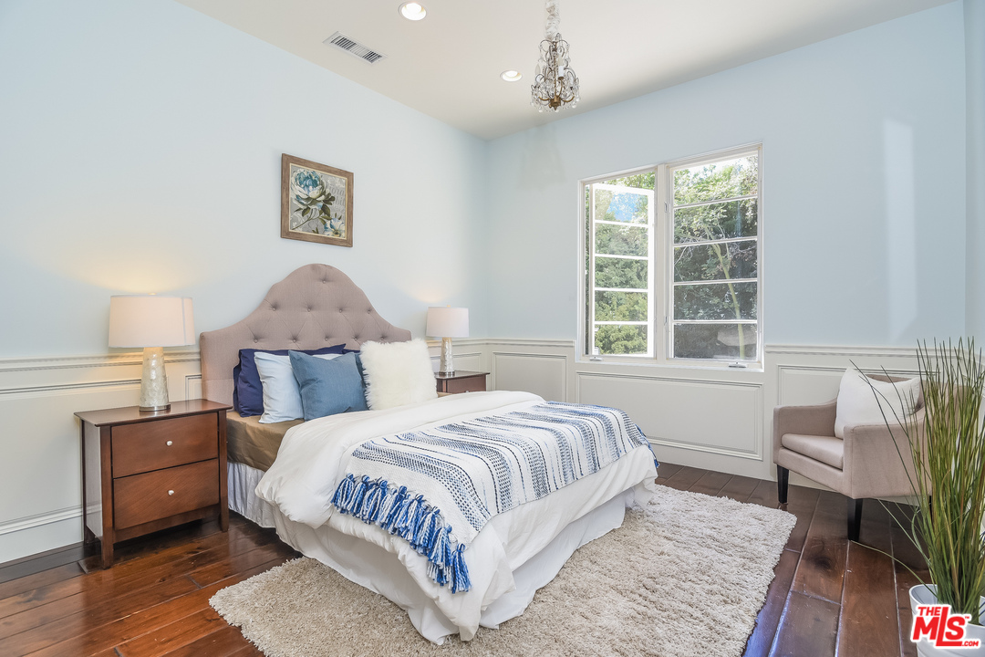 3901 Longridge Avenue Sherman Oaks, CA 91423 - Photo 28 of 51 a bedroom with a large bed and a window