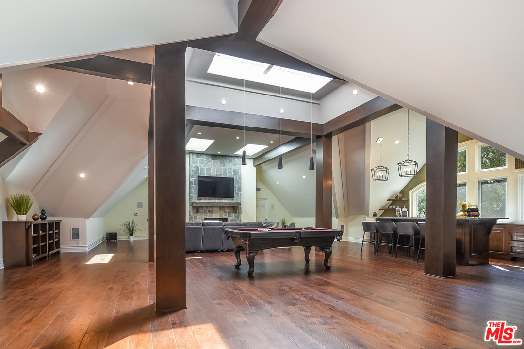 3901 Longridge Avenue Sherman Oaks, CA 91423 - Photo 35 of 51 a living room with furniture and wooden floor
