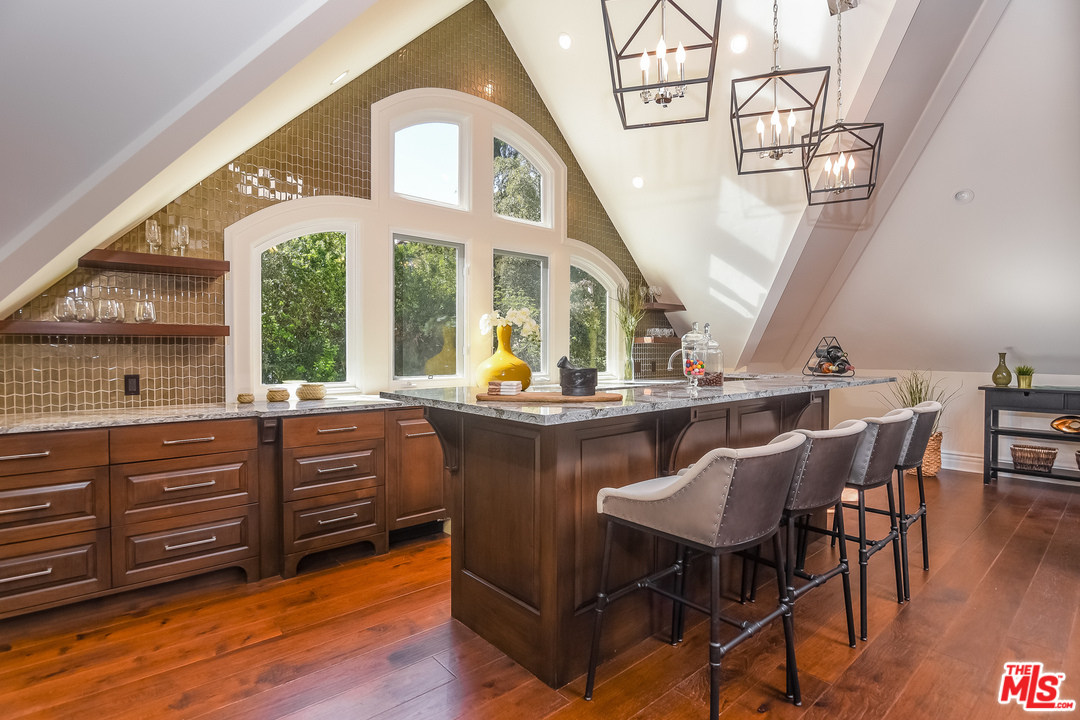 3901 Longridge Avenue Sherman Oaks, CA 91423 - Photo 38 of 51 a view of a dining room with furniture window and wooden floor