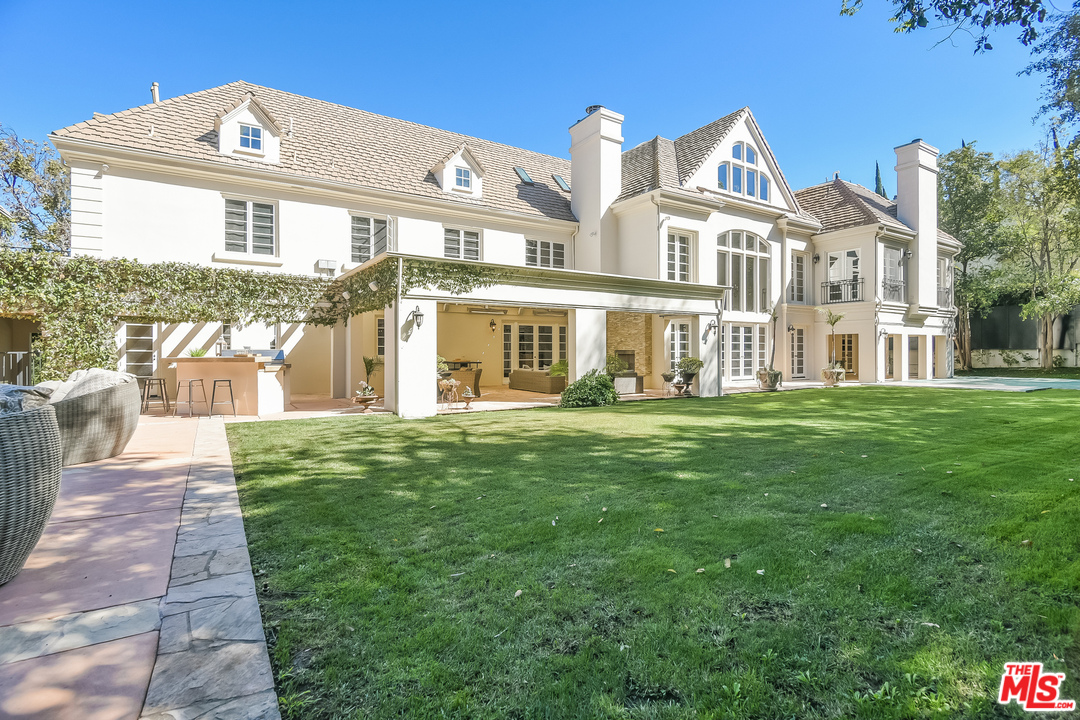 3901 Longridge Avenue Sherman Oaks, CA 91423 - Photo 46 of 51 a front view of a house with a garden