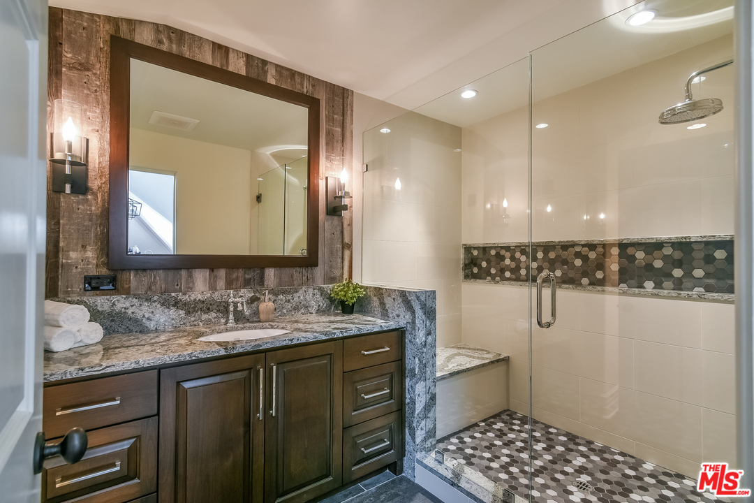 3901 Longridge Avenue Sherman Oaks, CA 91423 - Photo 8 of 51 a bathroom with a sink a toilet and a mirror