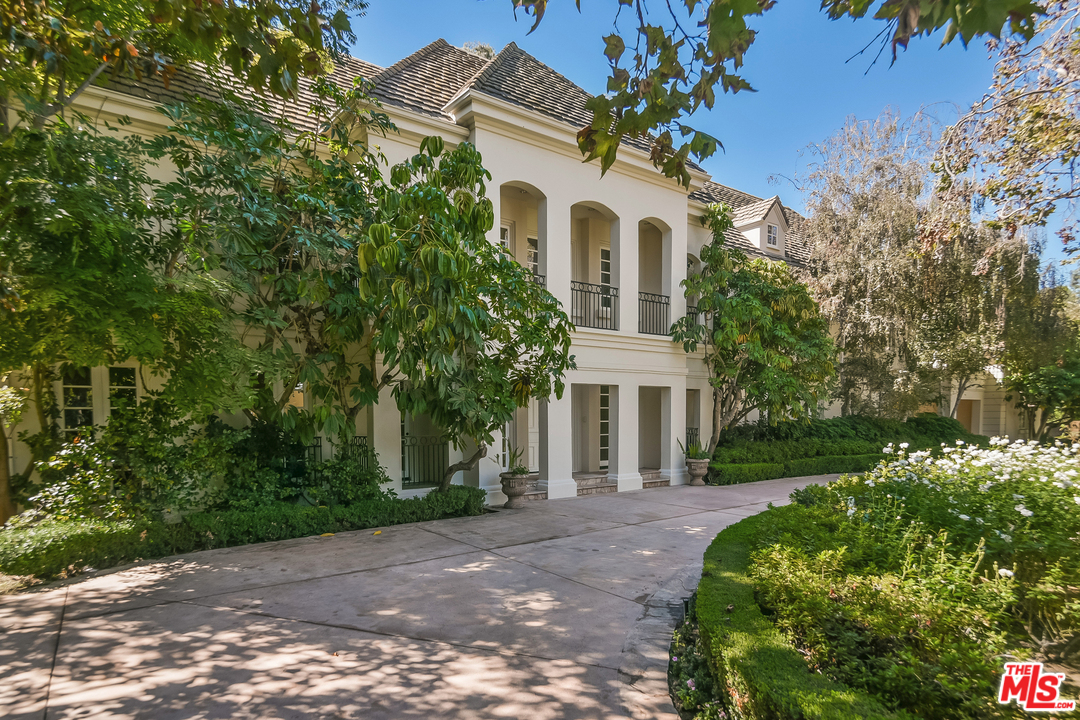 3901 Longridge Avenue Sherman Oaks, CA 91423 - Photo 9 of 51 a front view of a house with garden