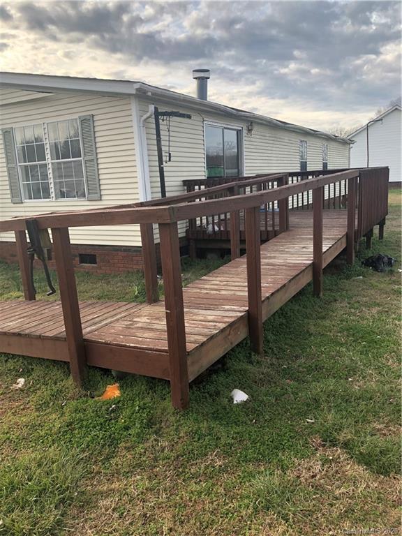140 Rithmetic Road Salisbury, NC 28147 - Photo 4 of 18 a view of a backyard with wooden fence