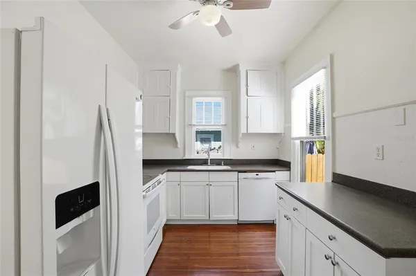 a kitchen with stainless steel appliances a stove a sink and a refrigerator