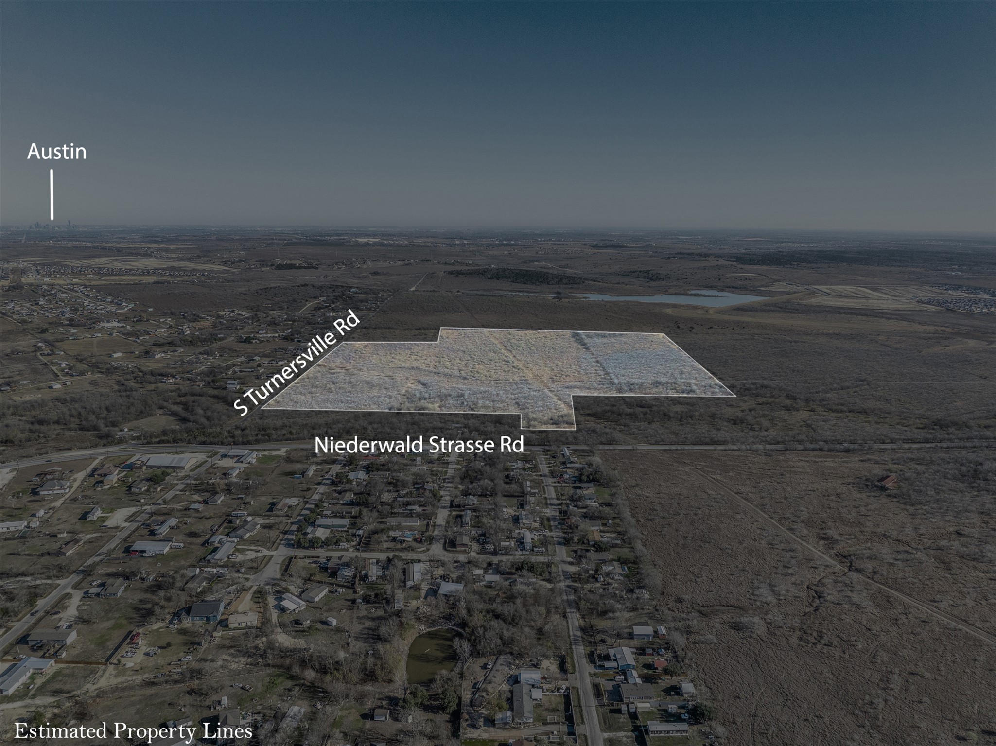 5225 Fm 2001 Buda, TX 78610 - Photo 2 of 40 Aerial view of property and surrounding area with rural landscape and a desert landscape