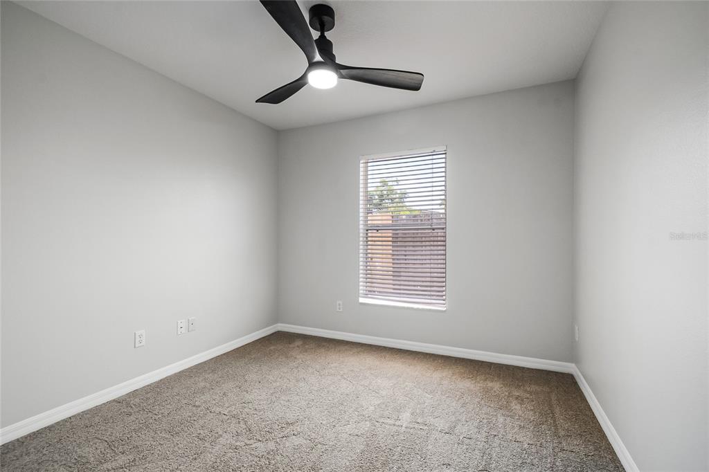 221 Rosa Avenue Oviedo, FL 32765 - Photo 19 of 36 an empty room with a ceiling fan and window