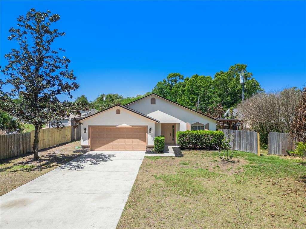 221 Rosa Avenue Oviedo, FL 32765 - Photo 2 of 36 a front view of a house with a yard