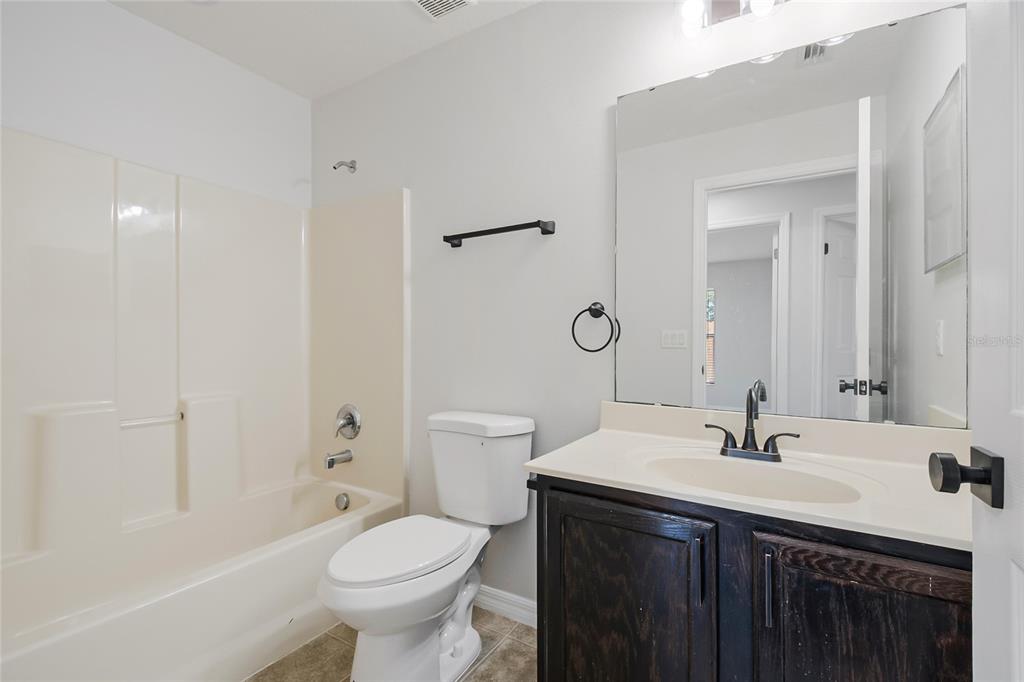 221 Rosa Avenue Oviedo, FL 32765 - Photo 21 of 36 a bathroom with a sink toilet and shower