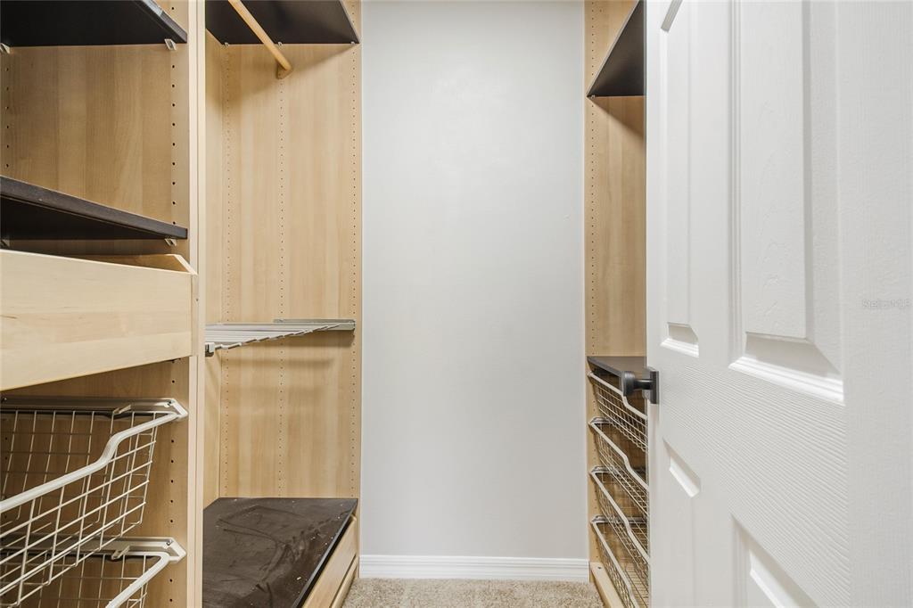 221 Rosa Avenue Oviedo, FL 32765 - Photo 27 of 36 a view of walk in closet with clothes and shoes