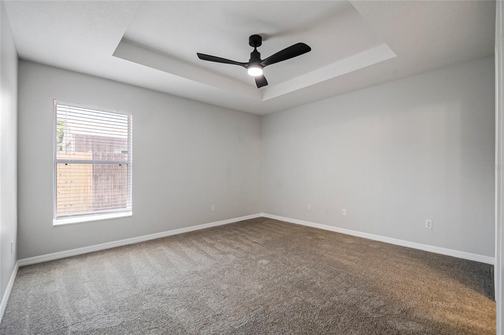 221 Rosa Avenue Oviedo, FL 32765 - Photo 28 of 36 an empty room with ceiling fan and windows