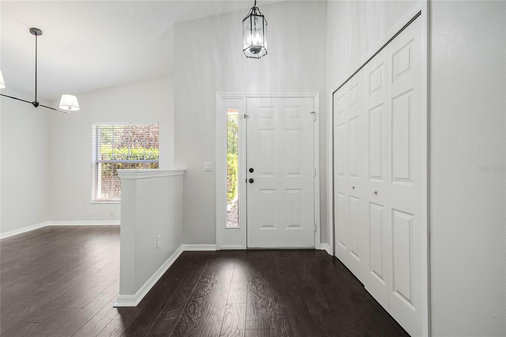 221 Rosa Avenue Oviedo, FL 32765 - Photo 5 of 36 a view of an empty room with wooden floor and a window