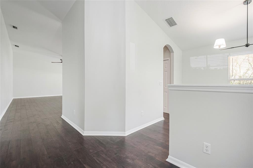 221 Rosa Avenue Oviedo, FL 32765 - Photo 6 of 36 an empty room with wooden floor and windows