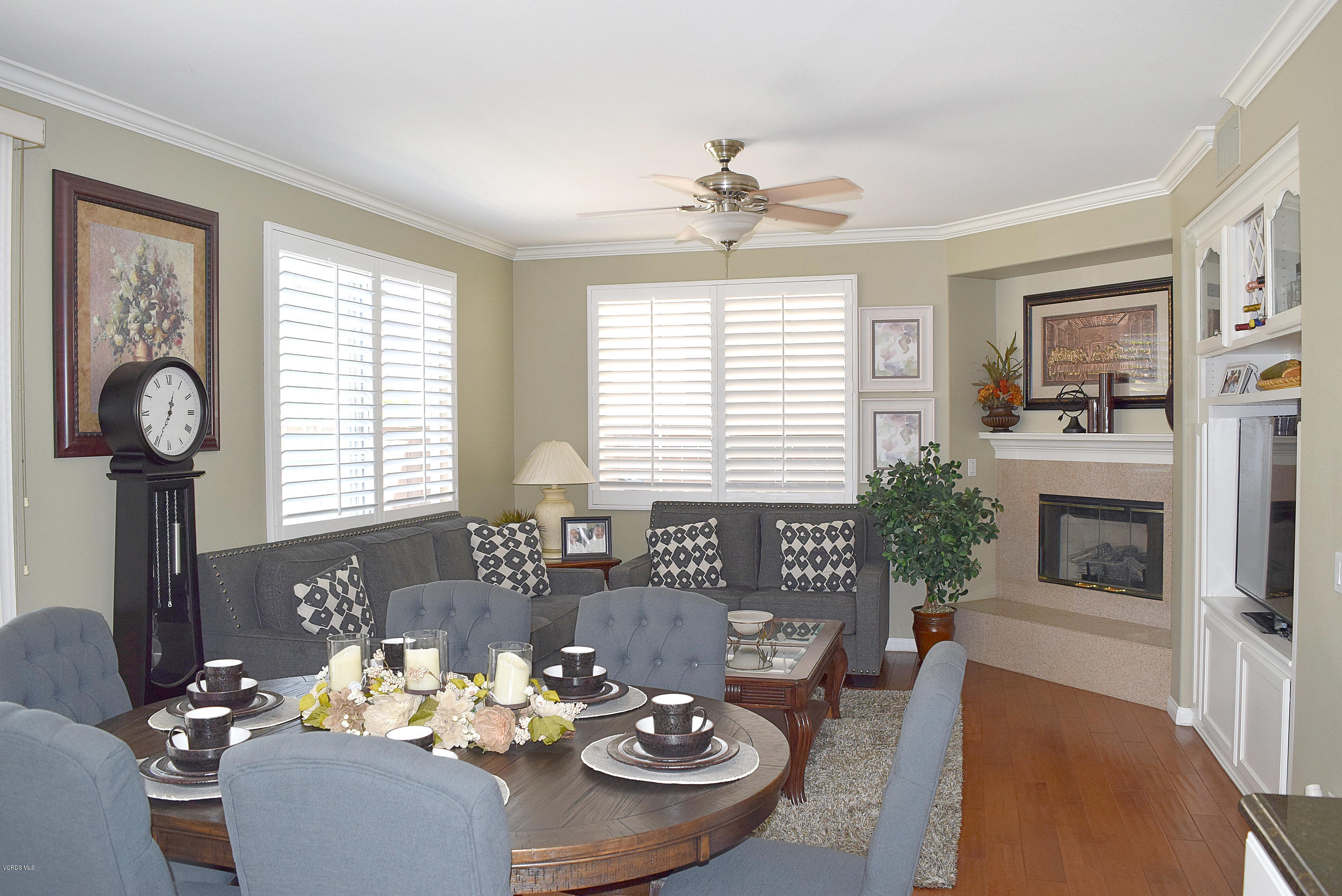 2103 Ribera Drive Oxnard, CA 93030 - Photo 3 of 24 a living room with furniture a fireplace and a table