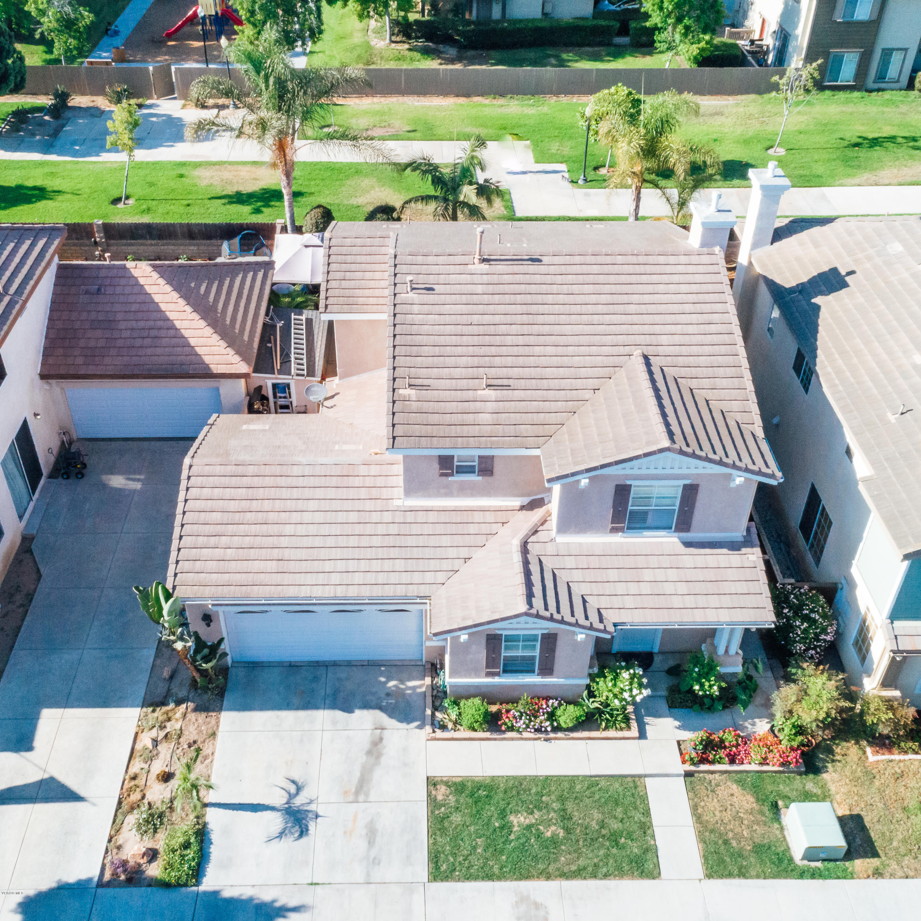 2103 Ribera Drive Oxnard, CA 93030 - Photo 22 of 24 a front view of a house with a yard