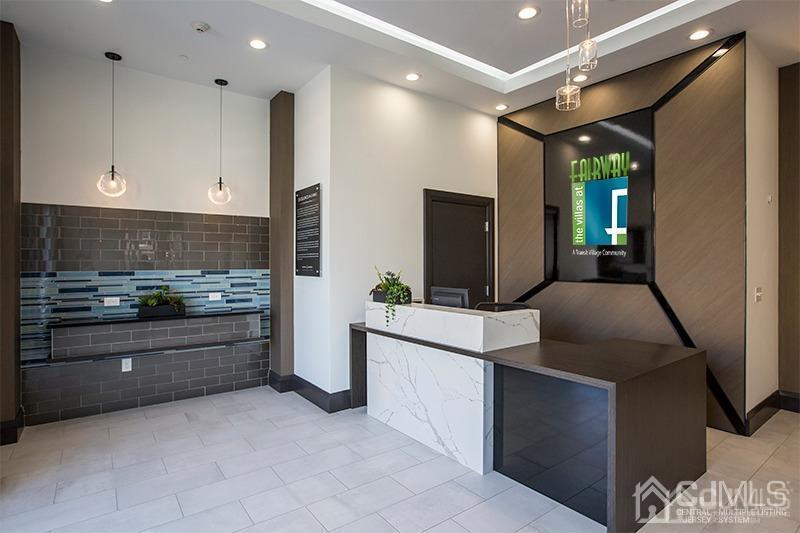 2106 Pine Valley Way Piscataway, NJ 08854 - Photo 2 of 26 a kitchen with stainless steel appliances kitchen island granite countertop a refrigerator and stove