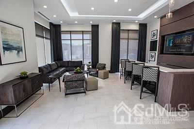 2106 Pine Valley Way Piscataway, NJ 08854 - Photo 3 of 26 a living room with furniture and a flat screen tv