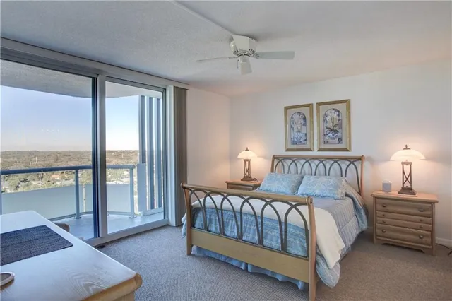 a bed room with a bed and a night stand