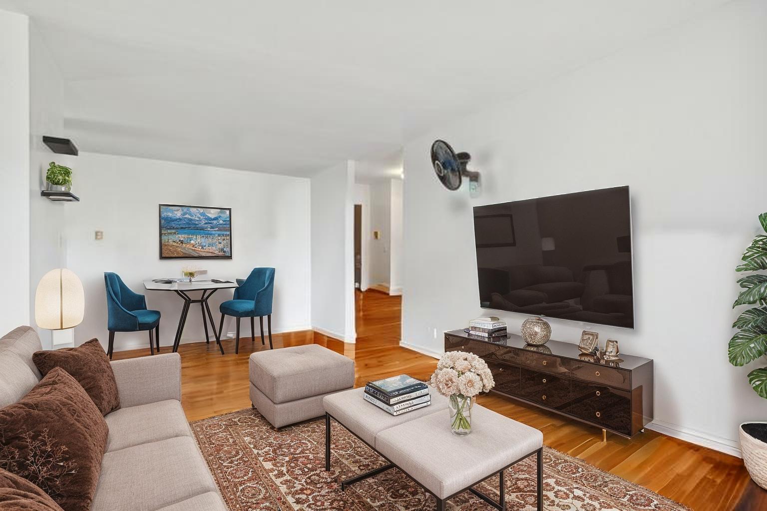 9561 Dee Road, Unit 2G Des Plaines, IL 60016 - Photo 8 of 18 a living room with furniture and a flat screen tv