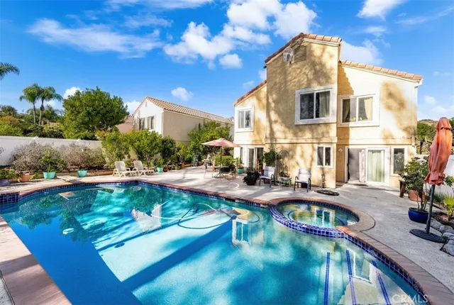 a view of a swimming pool with a patio