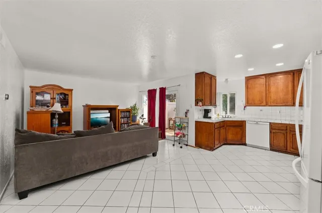 a large room with a large window and furniture