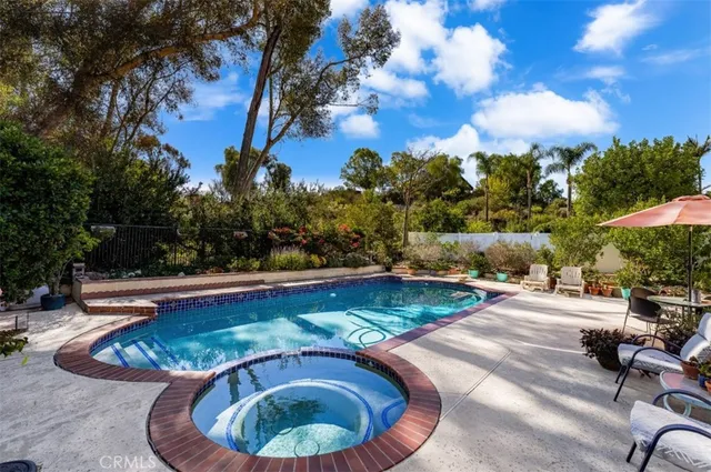 a view of swimming pool having outdoor seating