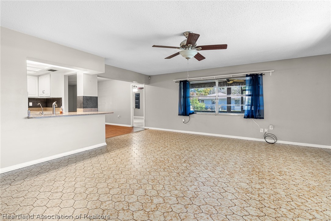 7100 Coral Ridge Road Sebring, FL 33876 - Photo 25 of 44 a view of a kitchen with a sink and a window