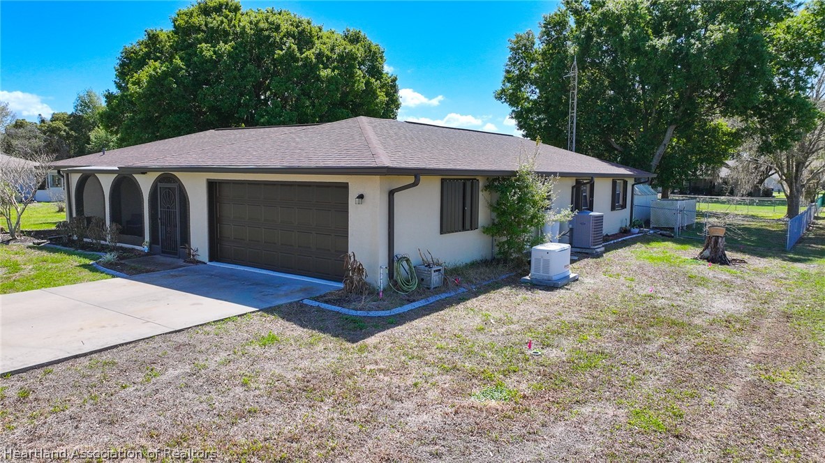 7100 Coral Ridge Road Sebring, FL 33876 - Photo 3 of 44 a view of a house with backyard and sitting area