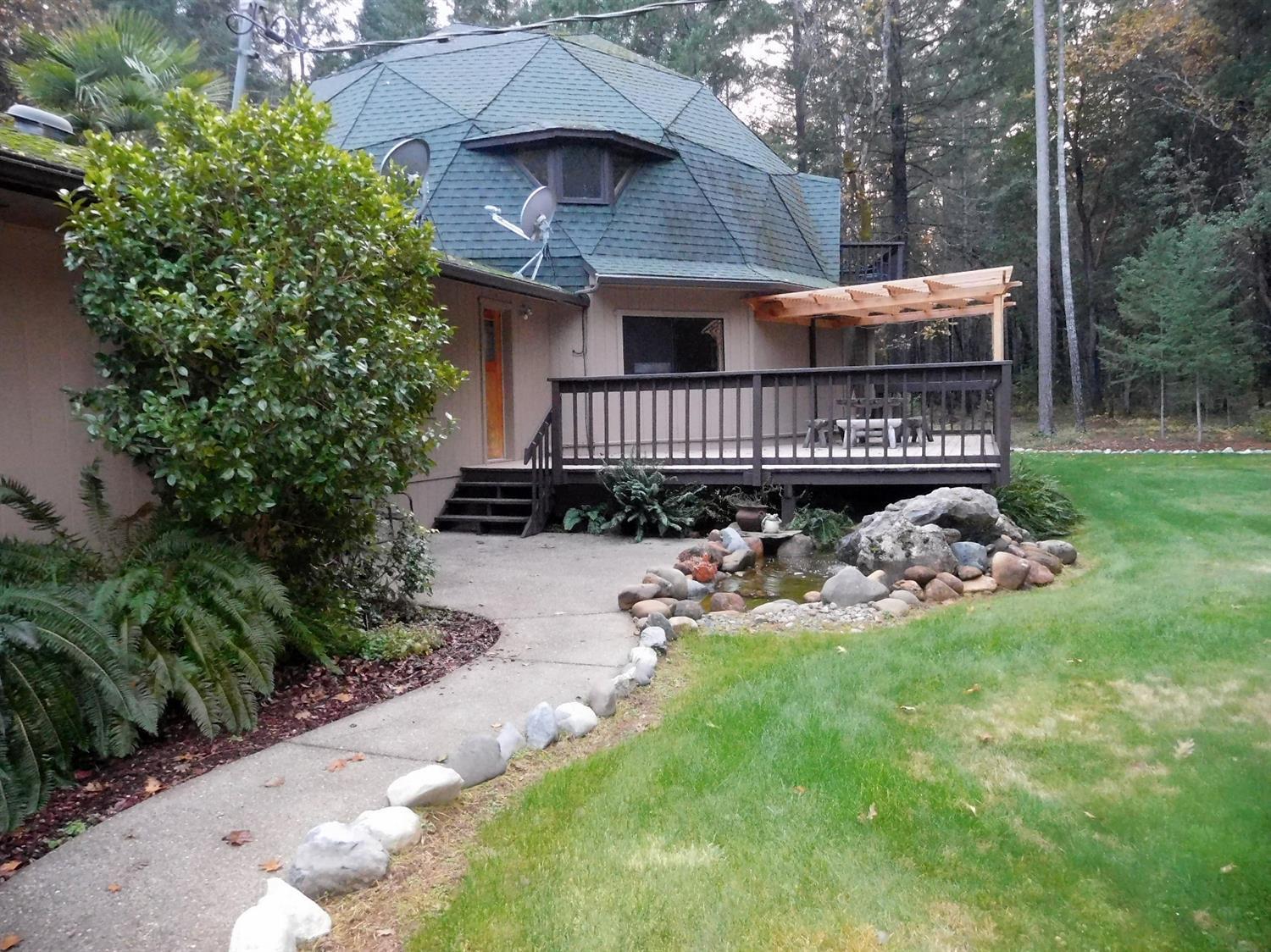 7133 Rockydale Road Cave Junction, OR 97523 - Photo 4 of 23 Closer view of the back of the home, dec