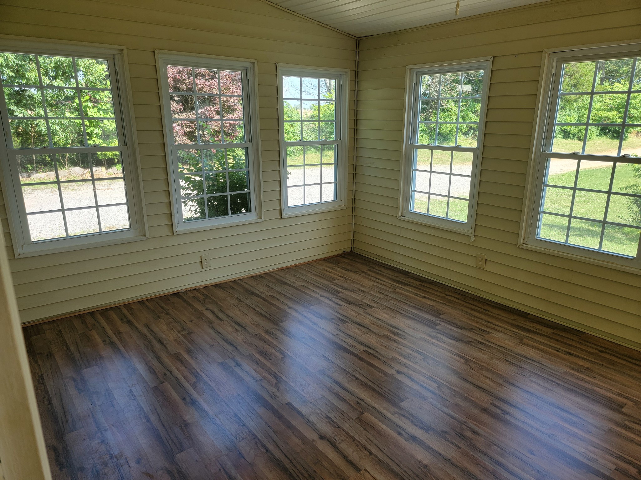 5814 Wayman Dunn Road Springfield, TN 37172 - Photo 6 of 65 a view of an empty room with wooden floor and a window