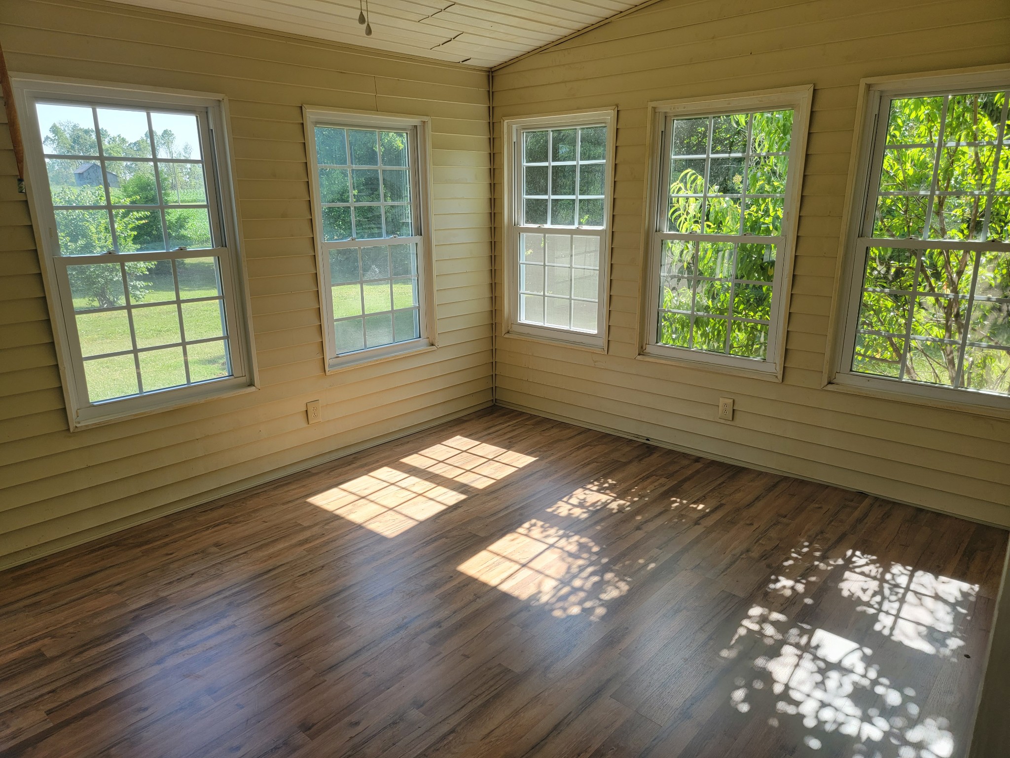 5814 Wayman Dunn Road Springfield, TN 37172 - Photo 8 of 65 a view of empty room with wooden floor and fan
