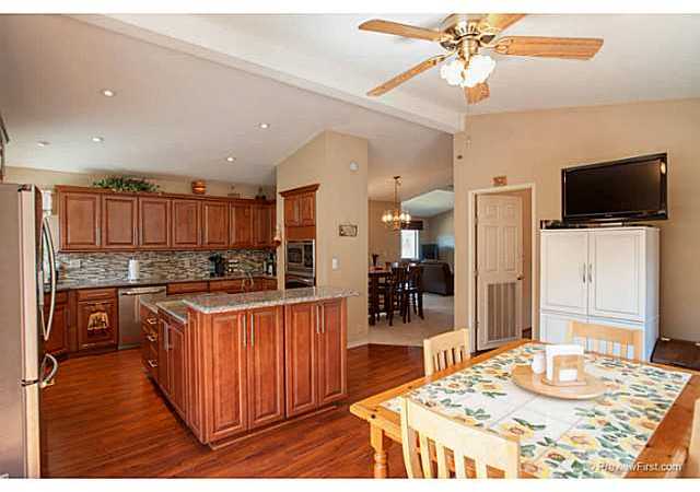 2204 Lookout Mountain Road Fallbrook, CA 92028 - Photo 12 of 25 The flooring has been updated to a laminate wood flooring to match the remodel & recessed lighting was installed to complete the room.
