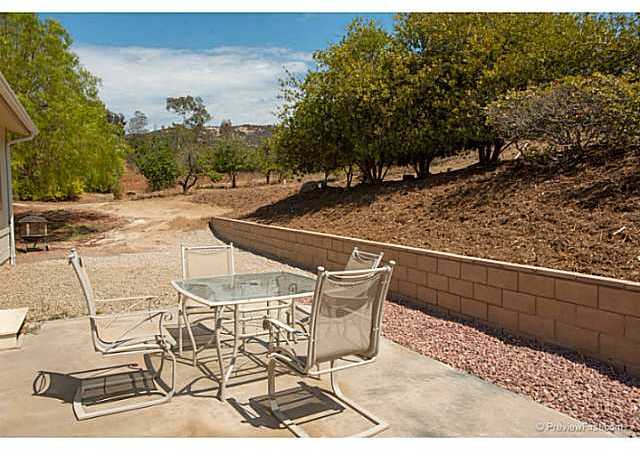 2204 Lookout Mountain Road Fallbrook, CA 92028 - Photo 17 of 25 This patio looks out to the orchard area. Avocados, oranges, apples & plums are just a few of the trees on the property