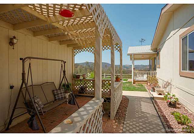 2204 Lookout Mountain Road Fallbrook, CA 92028 - Photo 19 of 25 Here is another covered sitting area in the front of the home.